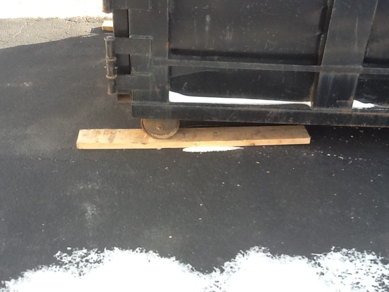 We protect your driveway by putting boards underneath all dumpsters